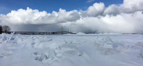 One of the Great Lakes in winter with the Mackinac Bridge in the background